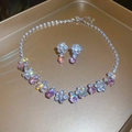 Silver flower jewelry set with pink stones including necklace and earrings on gold tray - 105# Necklace-Silver-Pink