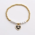 Elegante pulsera de perlas y cuentas doradas con dije de corazón y ojo turco - Negro