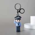 3D cartoon police officer PVC keychain with blue uniform and saluting pose - Police Officer Male