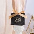 Elegant black gift bag with gold ribbon and Thank You gold foil text on pedestal - Small / Black THANK YOU (Champagne Ribbon)