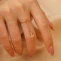 Golden heart ring with a dangling chain and starfish charm for women in retro style - Starfish Style (N-723)