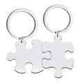 Macro view of polished silver stainless steel puzzle piece keychains for couples - Silver Blank Keychain Set
