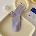 Light purple ribbed cotton mid-tube socks displayed on a minimalist decorative tray - One Size / Milky Purple