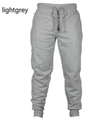 Light grey men's casual joggers with elastic drawstring waist and ribbed ankle cuffs - S / Light Gray