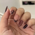 Brown tortoiseshell press-on nails in almond shape with French tips on hands - Brown Tortoiseshell Almond Nails (JP4094)