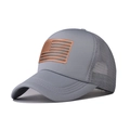 Close-up of gray trucker hat with brown leather US flag patch and breathable mesh - Light Gray