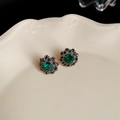 Macro view of vintage silver flower earrings with emerald stones on ceramic tray - 13# Silver Pin Earrings - Antique Silver - Emerald Flower