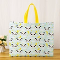 Cute light blue non-woven bag featuring cartoon panda prints and yellow handles - Moon Panda