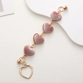 Detail of pink velvet heart charm with gold chain and screw-on closure for DIY cases - Pink