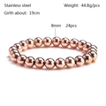 Detail view of 8mm rose gold stainless steel beads on an elastic stretch bracelet - Rose Gold 8mm