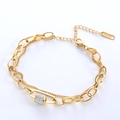 Double-layered gold stainless steel chain bracelet with a crystal-studded cylinder charm - Gold