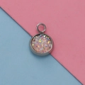 Detail of 12mm stainless steel pendant tray with pink glitter stones on split background - Sparkle Pink Crushed Stone Style (24)