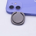 Close-up of matte dark gray metal ring holder on purple phone with 360-degree rotation - Glossy Black