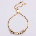 Elegante bracciale a sfere dorate regolabile con micro-pavé di pietre in zircone bianco - Oro