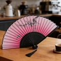 Pink gradient folding fan with ink plum blossom pattern and black wooden frame - Style 63 (New Style)