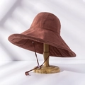 Detail of a brown wide-brim sun hat on a wooden stand with elegant natural light shadows - M(56-58cm) / Upgraded Rust Red (21I021)