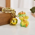 Cute light green dragon keychain with golden bell for bags and car keys decoration - Ball-holding Dragon Style
