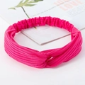 Elastic knitted twist headband in vibrant rose red with ribbed texture for daily wear - Knitted Rose Red