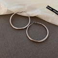 Minimalist silver circular hoop earrings with smooth polished finish and zircon accents - Large Silver Round Hoop Earrings