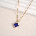 Elegant gold necklace featuring a dark blue square cubic zirconia sugar cube pendant - Blue