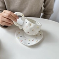 Hand-painted irregular white ceramic coffee cup with floral patterns and wavy handle - Small Tulip Cup & Saucer Set / Cup + Saucer Set