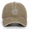 Detailed embroidery of a skeleton hand and Good Vibes on a khaki washed cotton baseball cap - Adjustable / Khaki
