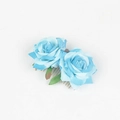 Detail shot of light blue fabric roses and green leaves on a metal hair comb - Lake Blue