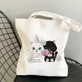 Detail of white canvas tote bag with cute cartoon cat illustrations and sturdy handles - Party Cats (B902-7)