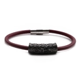 Macro detail of the dark red braided cord bracelet featuring a magnetic cross clasp - Black W