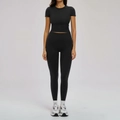 Two-piece black yoga set featuring a tight short-sleeve crop top and high-waist leggings - S / Top And Bottom / Premium Black