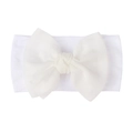 Detailed view of white nylon baby headband with a soft mesh bow accent for toddlers - White