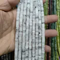 Macro shot of natural white stone spacer beads with unique black veins for DIY jewelry - Black Rutilated Quartz