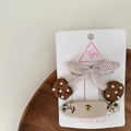 Detail of fabric cherry and bow hair clips set for girls on a wooden tray display - Cherry Hair Clip
