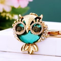 Golden owl keychain with large emerald crystal and sparkling rhinestones for handbags - Gemstone Owl Green