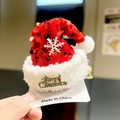 Macro view of Christmas hair clip with red velvet, fur trim and Merry Christmas plaque - Bright Red Sequin Drooping Hat Clip