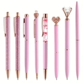 Detail of eight assorted pink and rose gold crown pens with glitter and crystal charms - Pink Jewelry Set