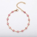 Detail of 13 hot pink glitter heart charms on a gold 18k plated stainless steel chain - 17+5cm / Pink