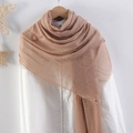Light brown crinkled cotton linen scarf with tassel edges on a wooden hanger - Tan