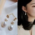 Detail view and model wearing golden double pearl drop earrings with natural teardrop shape - 1# Double Freshwater Pearl Drop (Silver Needle)