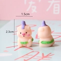 Macro detail of a cute mini resin pig figurine showing 2.3cm height dimensions - Pig with Green Swim Ring