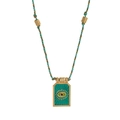 Macro detail of emerald enamel evil eye tarot pendant with braided colorful rope cord - Blue Eye Necklace