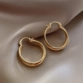 Elegant gold double hoop earrings with twisted texture on beige silk background - E5932 Gold Double Layer Hoops