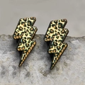 Ethnic lightning earrings featuring sparkly gold leopard print on a grey stone background - 6-Leopard Lightning