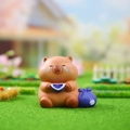 Cute brown capybara desk figurine with sad expression holding a blue heart bowl - 3087 Crying Capybara