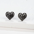 Macro detail of minimalist hollow heart-shaped studs in matte black finish - Heart / Black