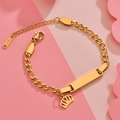 Detail of gold stainless steel bracelet with crown pendant and engraved plate charms - Gold Crown