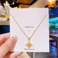 Collier élégant en acier titane doré avec un pendentif étoile en zircone étincelant - Étoile à huit branches dorée