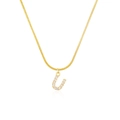 Detailed close-up of golden letter U pendant with micro-paved diamonds on a snake chain - Letter U