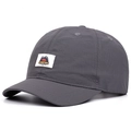 Detail of a dark grey quick-dry baseball cap featuring a short brim and camping patch - Adjustable / Gray