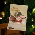 3D pop-up Christmas card featuring Santa on a sleigh with snowmen and writing lines - Model H665 (Sleigh Santa)